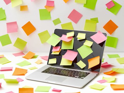 Laptop with multicoloured sticky notes by DS Stories on Pexels