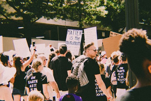 A group of people with signs protesting