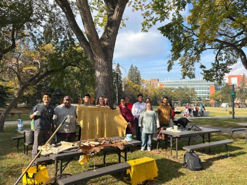 Group photo at the hide tanning event featuring guest Winston Wadsworth, UASU VPs, and others